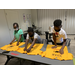 Young boys placing decals on t-shirts