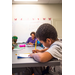 Young child writing with a pencil