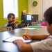 Boy looking at a paper with a pencil