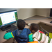 Two boys looking at a computer screen