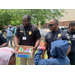 kids getting popsicles from officers