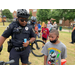 boy with popsicle talking to an officer