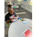 girl sitting down reading a book