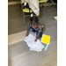 little girl sitting on the floor with papers