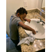 boy wiping down a sink
