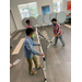 children helping set up tennis net