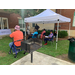 people sitting under a tent