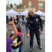 Police officer talking to children