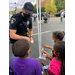 Police officer handing out stickers
