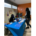 woman waiting at table with walmart employees