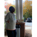 a woman talking holding a box of food