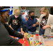 children standing together doing crafts