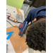 boy using hot glue gun