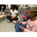 three girls sitting together with their crafts