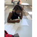 little girl taking notes