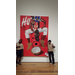 boy scouts standing next to a poster on the wall