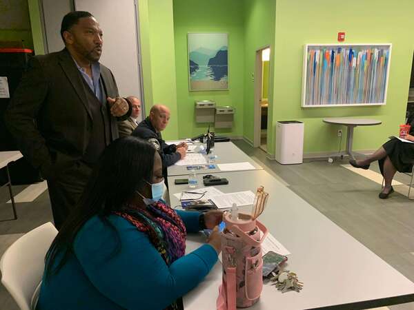 man speaking at a table