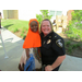 girl standing next to police officer smiling