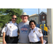 man standing next to two police officers smiling