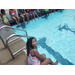 a girl sitting by the pool