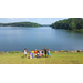 children in front of a lake