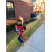 Boy in a red jersey running with a football